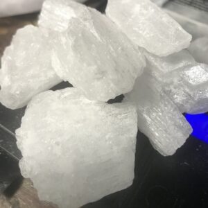 "Crystal methamphetamine: clear, crystalline shards of the illicit drug known for its highly addictive properties and severe health risks.