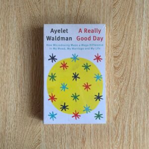 Cover of "A Really Good Day" by Ayelet Waldman, featuring colorful pills arranged in a pattern, symbolizing the microdosing journey and mental health transformation.