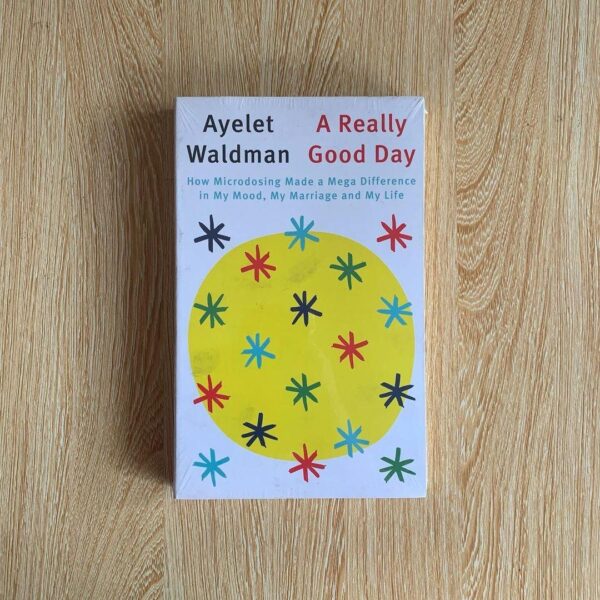 Cover of "A Really Good Day" by Ayelet Waldman, featuring colorful pills arranged in a pattern, symbolizing the microdosing journey and mental health transformation.